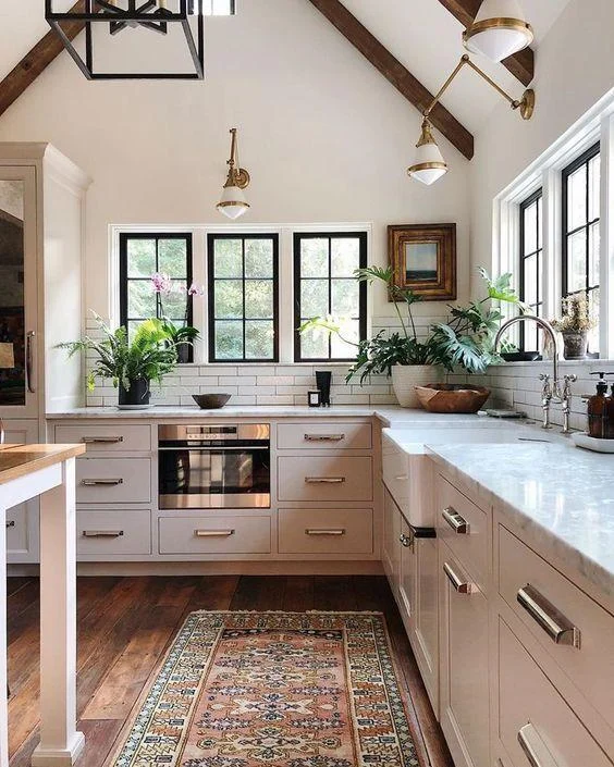 Love this beautiful kitchen with vaulted cathedral ceilings and a vintage rug - jean stoffer interior design - stoffer photography